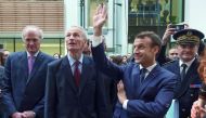 French President Emmanuel Macron waves as he stands next to Michelin group chairman Jean-Dominique Senard during a visit at the Michelin Ladoux Research and Technology centre in Ladoux, France, January 25, 2018. Reuters/Thierry Zoccolan