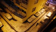 An Iranian man walks in an ally during a heavy snowfall in Tehran, Iran, 27 January 2018. EPA/ABEDIN TAHERKENAREH