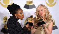 Actors Kristolyn Lloyd (L) and Rachel Bay Jones pose with the Best Musical Theater Album trophy for 