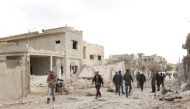 Damaged buildings are seen after Russian and Assad regime airstrikes hit Kafr Amin district of Syria's Idlib province, which is a part of a de-escalation zone. Ubeyde Fad?l - Anadolu
