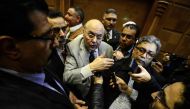 Presidential candidate Moussa Mustafa Moussa (C), the head of the Ghad Party, speaks during press conference in Cairo on January 29, 2018, after presenting his application to run in the March elections. AFP / Mohamed El-Shahed