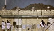 FILE PHOTO: Detainees talk together inside the open-air yard at the Camp 4 detention facility at Guantanamo Bay U.S. Naval Base in Cuba, May 31, 2009. REUTERS/Brennan Linsley/Pool/File Photo	
