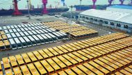 This aerial view shows new buses lined up for export at a port in Lianyungang, east China's Jiangsu province on January 31, 2018. AFP