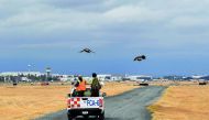 Two Harris's hawks (Aguililla de Harris in Spanish) (Parabuteo-unicinctus) are released by personnel of the Fumigation and Avian Control company to patrol the runways and air space over Mexico City's Benito Juarez International Airport on January 29, 2018