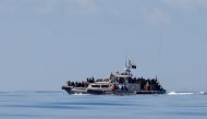 Migrants are seen onboard a Libyan Coast Guard vessel following a rescue operation in central Mediterranean Sea, January 31, 2018.  Reuters/Alkis Konstantinidis