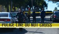 Police guard a roadblock to Salvadore Castro Middle School in Los Angeles, California on February 1, 2018, where two students were wounded, one critically, in a school shooting. / AFP / Frederic J. Brown