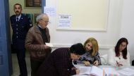Voters are seen during the second round of the presidential election in Limassol, cyprus February 4, 2018. REUTERS/Yiannis Kourtoglou 