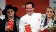 From L-R, French chef Marc Veyrat, awarded with three Michelin stars for his restaurant La Maison des Bois in Manigod, French chef Christophe Bacquie, awarded with three Michelin stars for his restaurant Hotel du Castellet in the Var region, and his wife 