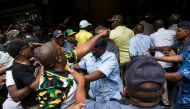  African National Congress (ANC) supporters are held back by the South African Police Service outside Luthuli House, the ANC headquarters, after supporters of the Black First Land First (BLF) movement handed a memorandum to the ANC secretary general in su