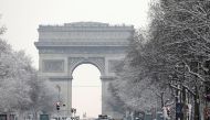  A view shows the traffic on the snow-covered Champs-Elysees avenue below the Arc de Triomphe in Paris, as winter weather with snow and freezing temperatures arrive in France, February 7, 2018. Reuters/Charles Platiau