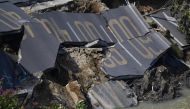 A damaged section of road is seen at an accident site after a road collapse in Foshan in China's southern Guangdong province on February 8, 2018. China OUT / AFP / 