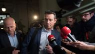 Belgian lawyer representing Paris attacks suspect Salah Abdeslam Sven Mary (L) and Belgian lawyer representing the civilian party and police officers Tom Bauwens (C) walk past journalists as they leave the 