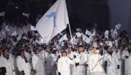 Hwang Chung Gum and Won Yunjong of Korea carry the unification flag during the opening ceremony. Reuters/Kim Kyung-Hoon