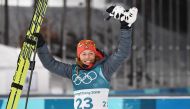 Germany's Laura Dahlmeier celebrates after wining gold in the women's 7,5 km sprint biathlon event during the Pyeongchang 2018 Winter Olympic Games on February 10, 2018, in Pyeongchang. (AFP / FRANCK FIFE)
