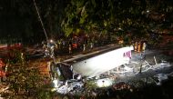 Rescuers work at the site of a crashed bus in Hong Kong, China February 10, 2018. China Daily via REUTERS 