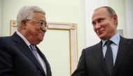 Russian President Vladimir Putin (R) shakes hands with Palestinian leader Mahmud Abbas during their meeting at the Kremlin in Moscow on February 12, 2018.  AFP / Sputnik / Maxim Shipenkov