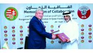 Sheikh Hamad bin Khalifa bin Ahmed Al Thani, President of Qatar Football  Association and  Sándor Csányi, President of Hungarian Football Federation excahnge documents during the signing ceremony.