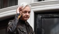 In this file photo taken on May 19, 2017 Wikileaks founder Julian Assange appears on the balcony after making an address to the media at the Embassy of Ecuador in London.  AFP / Justin Tallis