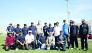 Q-Chem officials posing for a photo on the sidelines of National Sport Day activities, yesterday.