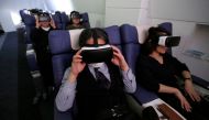 Guests wearing virtual reality (VR) goggles are seen at the 