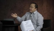 This photo taken on February 16, 2018 shows lawyer Jude Sabio gesturing as he shows the communication he submitted to the International Criminal Court against Philippine President Rodrigo Duterte, during an interview in Manila. AFP / NOEL CELIS
