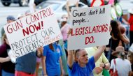 Stefanie Hartman of Coconut Creek, Florida, holds a sign during the March for Action on Gun Violence in Broward County in Fort Lauderdale, Florida, US, February 17, 2018. REUTERS/Joe Skipper 