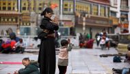 FILE PHOTO: Tibetans pray outside Jokhang Monastery ahead of Tibetan New Year's Day in Lhasa, Tibet autonomous region, February 28, 2014. Reuters/Jacky Chen/File Photo	