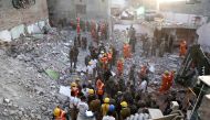 Indian Army, NDRF and SDRF personnel carry out rescue work after a building collapsed due to a gas cylinder blast during wedding party in Beawar, in the Indian state of Rajasthan on February 18, 2018. AFP 