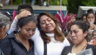 Relatives and friends of thirteen people killed when a military helicopter fell on a van in Santiago Jamiltepec, Oaxaca state, Mexico, attend the funeral of one of the victims, on February 18, 2018. AFP / ALFREDO ESTRELLA