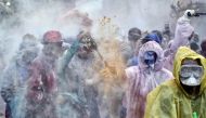 Revellers participate in a 'flour war' during 'Ash Monday' celebrations, a traditional festivity marking the end of the carnival season and the start of the 40-day Lent period until the Orthodox Easter, in the port town of Galaxidi, Greece, on February 19
