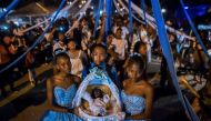 Afro-Colombians hold a basket with 