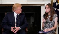 US President Donald Trump listens as Marjory Stoneman Douglas High School Carson Abt speaks during a “listening session” on gun violence with teachers and students in the State Dining Room of the White House on February 21, 2018. AFP / MANDEL NGAN