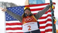 Gold medallist David Wise of the U.S. celebrates during flower ceremony, February 22, 2018. REUTERS/Issei Kato