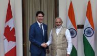 Canadian Prime Minister Justin Trudeau (L) and Indian Prime Minister Narendra Modi shake hands before a meeting at Hyderabad house in New Delhi on February 23, 2018.  / AFP / MONEY SHARMA 