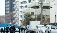Japanese police stand guard near the General Association of Korean Residents in Japan that serves as a defacto embassy for North Koreans, in Tokyo on February 23, 2018. Japan OUT / AFP / JIJI PRESS 