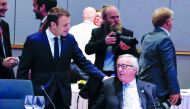 French President Emmanuel Macron talks with European Commission President Jean-Claude Juncker during a European Union leaders informal summit in Brussels, Belgium, February 23, 2018. Reuters/Yves Herman