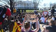Hundreds of high school and middle school students from the District of Columbia, Maryland and Virginia staged walkouts and gather in front of the White House in support of gun control in the wake of the Florida shooting February 21, 2018 in Washington, D