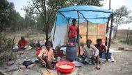 A man cooks a meal in his makeshift restaurant on the island of Bhasan Char in the Bay of Bengal, Bangladesh February 14, 2018. Picture taken February 14, 2018. REUTERS/Stringer