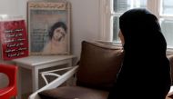 Sameh, a mother of two who suffered psychological abuse at the hand of her husband, speaks to a reporter in Tunis on February 20, 2018.  / AFP / FETHI BELAID 