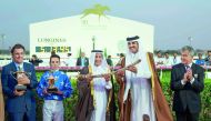 The Emir H H Sheikh Tamim bin Hamad Al Thani handing over the Emir’s Golden Sword to H E Sheikh Mohammed bin Khalifa Al Thani, the owner of winning horse Gazwan during the presentation ceremony held at the  Qatar Racing and Equestrian Club yesterday. Gazw