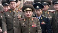 (FILES) This file picture taken on December 13, 2007 shows North Korea's chief delegate Kim Yong Chol (C) and North Korean soldiers crossing the border which divides the two Koreas to attend the inter-Korean general talks at the South's side of the truce 
