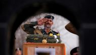Incense sticks burn as an Indian Border Security Force (BSF) officer salutes to a coffin containing the body of a soldier, who according to BSF died on Wednesday after he was injured in a gunfire on Tuesday at the Line of Control (LOC) with Pakistan in Ka