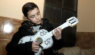 (FILES) In this file photo taken on January 24, 2018 Mexican singer Luis Angel Jaramillo, 13, rehearses with his guitar before a concert during the Villa Hidalgo Fair in Jalisco state, Mexico. AFP / ULISES RUIZ