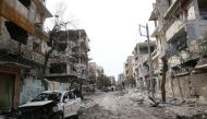 Damaged cars and buildings are seen in the besieged town of Douma, Eastern Ghouta, Damascus, Syria February 25, 2018. REUTERS/Bassam Khabieh