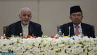 Afghan President Ashraf Ghani (L) talks as Indonesian Vice President Jusuf Kalla (R) looks on at the second Kabul Process conference at the Presidential Palace in Kabul on February 28, 2018. AFP / Shah Marai 
