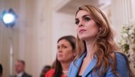 (FILES) In this file photo taken on February 21, 2018 White House Communications Director Hope Hicks watches as US President Donald Trump takes part in a “listening session” on gun violence with teachers and students in the State Dining Room of the White 
