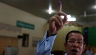 Cambodia's Prime Minister and President of the Cambodian People's Party (CPP), Hun Sen shows his ink-stained finger during a Senate election in Takhmao, Kandal province, Cambodia February 25, 2018. REUTERS/Samrang Pring	