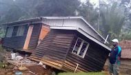 A local stands next to a damaged house near a landslide in the town of Tari after an earthquake struck Papua New Guinea's Southern Highlands in this image taken February 27, 2018 obtained from social media. Francis Ambrose/via REUTERS 