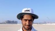 HBK’s bowler Malik poses for a photograph after his match-winning performance of 7 for 50.