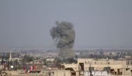 Smoke rises after Assad Regime's airstrike hit residential areas in Eastern Ghouta, Damascus, Syria on March 02, 2018.  Samir Tatin - Anadolu